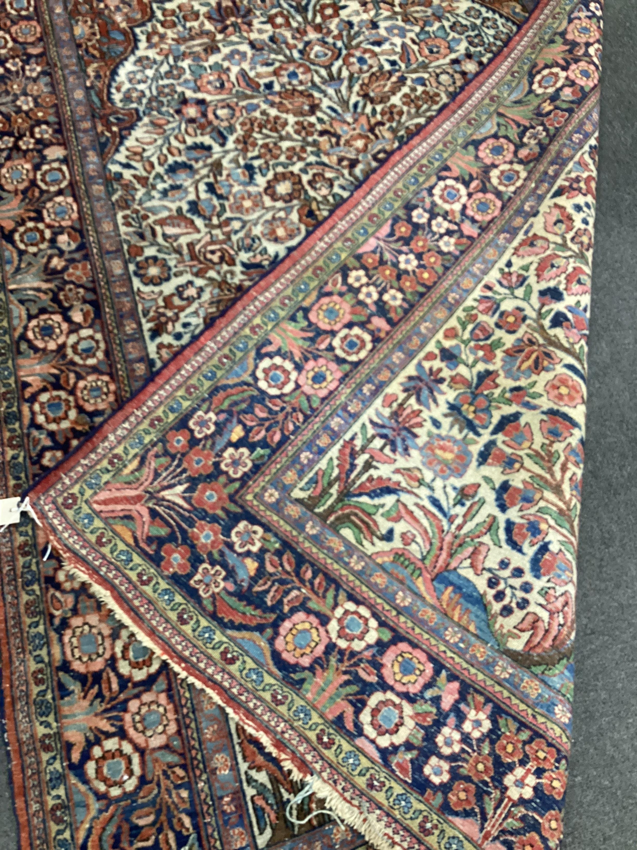 A North West Persian ivory ground rug, a Kuba blue ground rug and a Karabagh type Boteh rug, largest 210 x 136cm